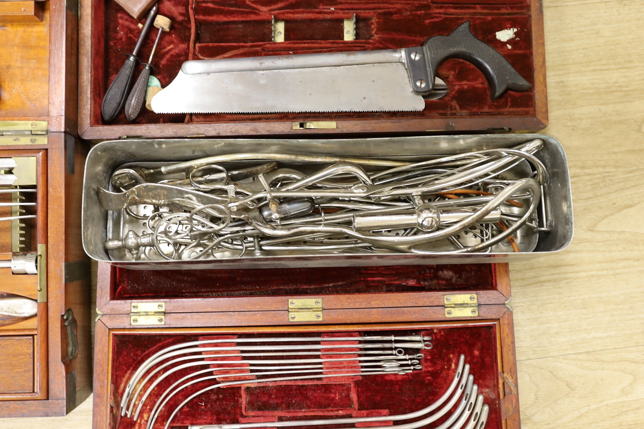 A 19th century mahogany cased field surgeon’s set (incomplete), and other field medical equipment, all three in brass banded mahogany boxes